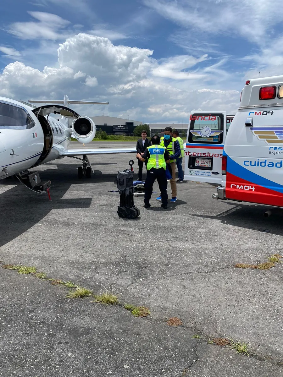 Learjet 35 air ambulance with ground ambulance on the ramp